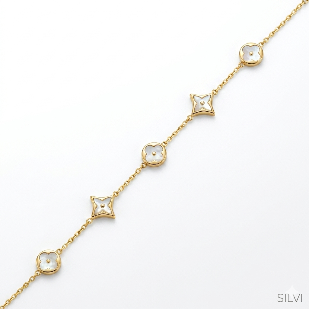 Gold plated white charm bracelet