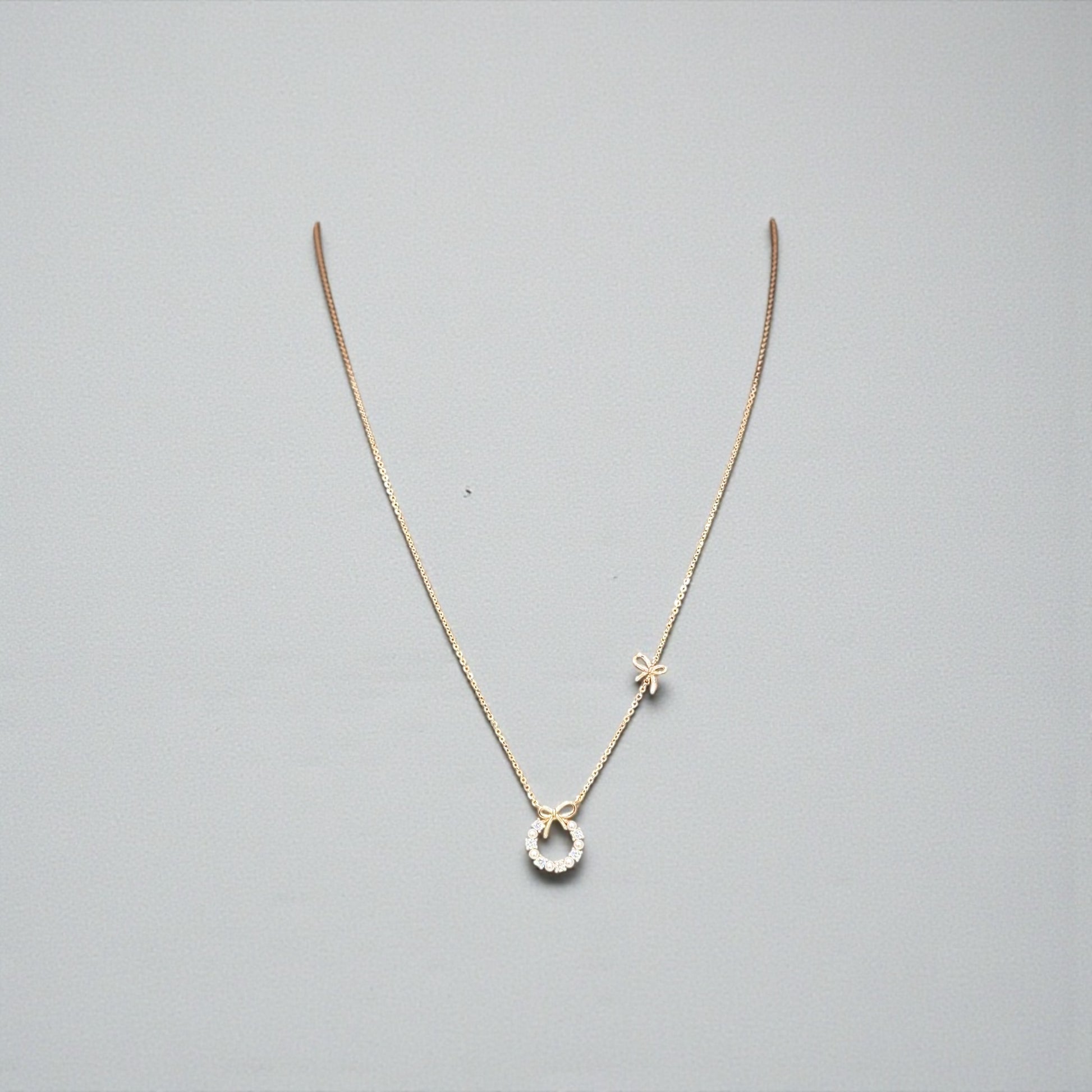 Golden Bow Wreath Pendant